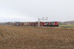 A pair of repainted IC GP38-2's pass under the southbound signals at Byron with cars for Quad Graphics